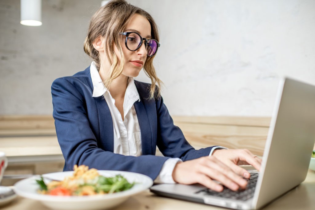 Businesswoman working during the lunch