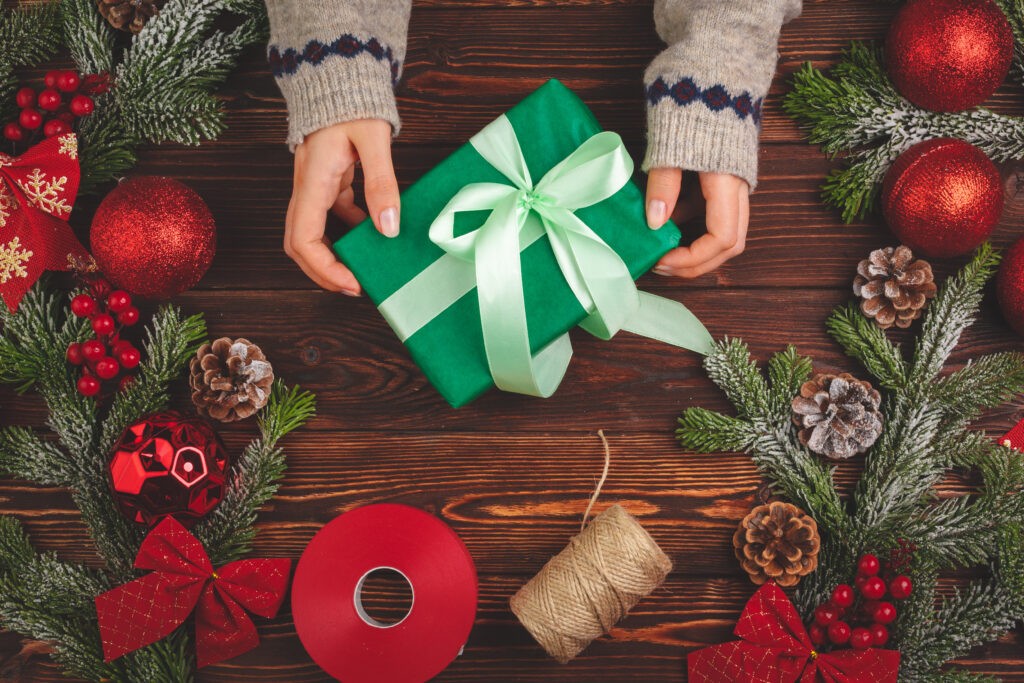 You should encourage participants to use the wrapping paper creatively. Extra elements like holiday lights and posters can also help promote creativity.