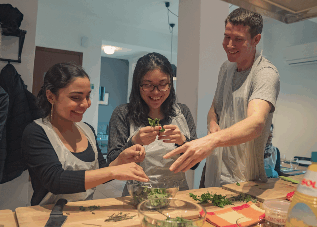 a group of people preparing a healthy meal together