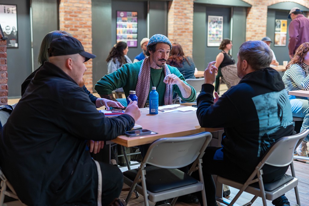 networking groups at tables in Venue 1 at ISH Venues