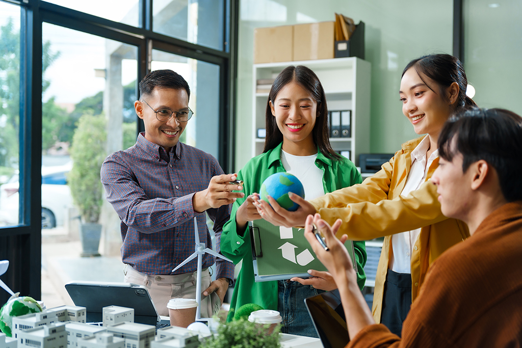 Colleagues meet at desk brainstorm environmental management strategies. discuss carbon emissions