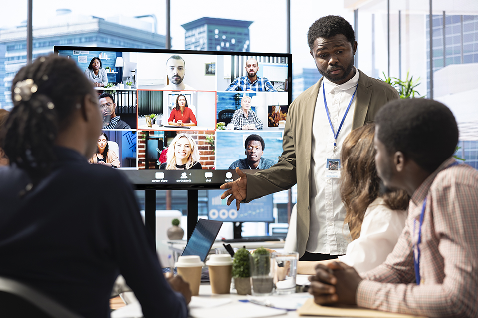 Company employees attending a meeting via videocall.