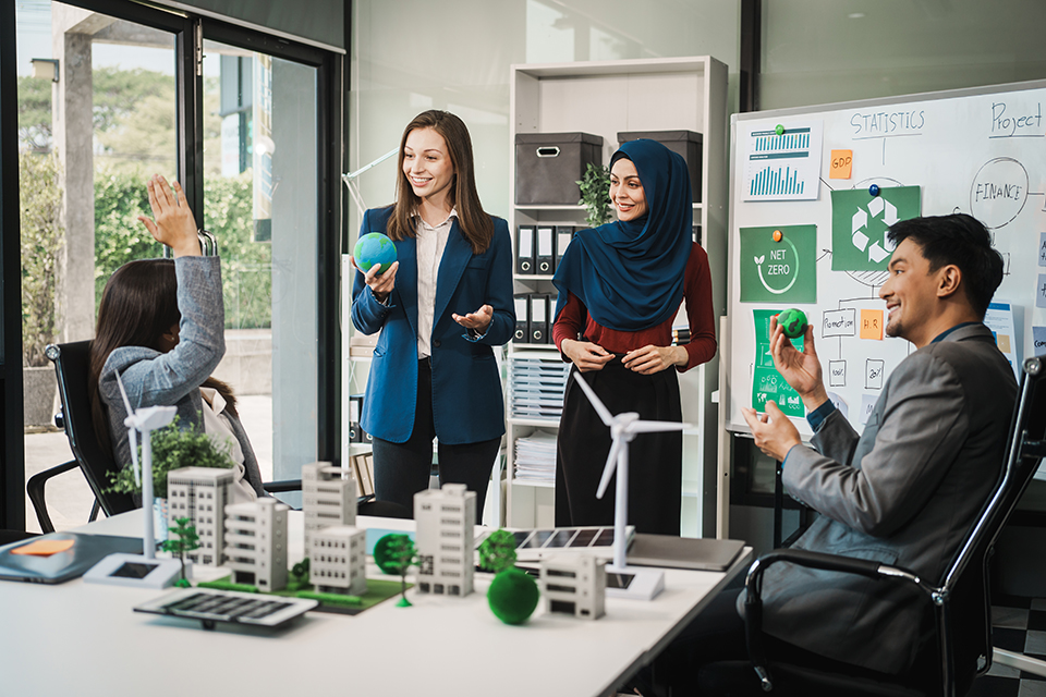 group of business people talking about sustainability and going green