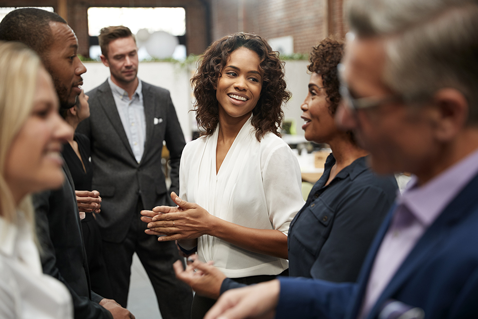 Group of business people networking at an office event