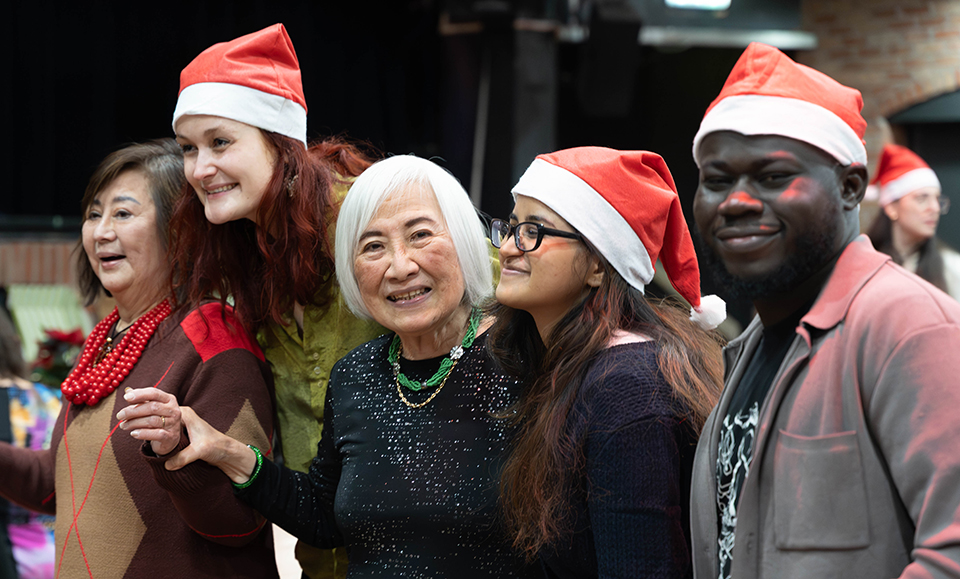 Multi-generational attendees coming together at International Students House in Venue 1 for a Christmas Celebration.
