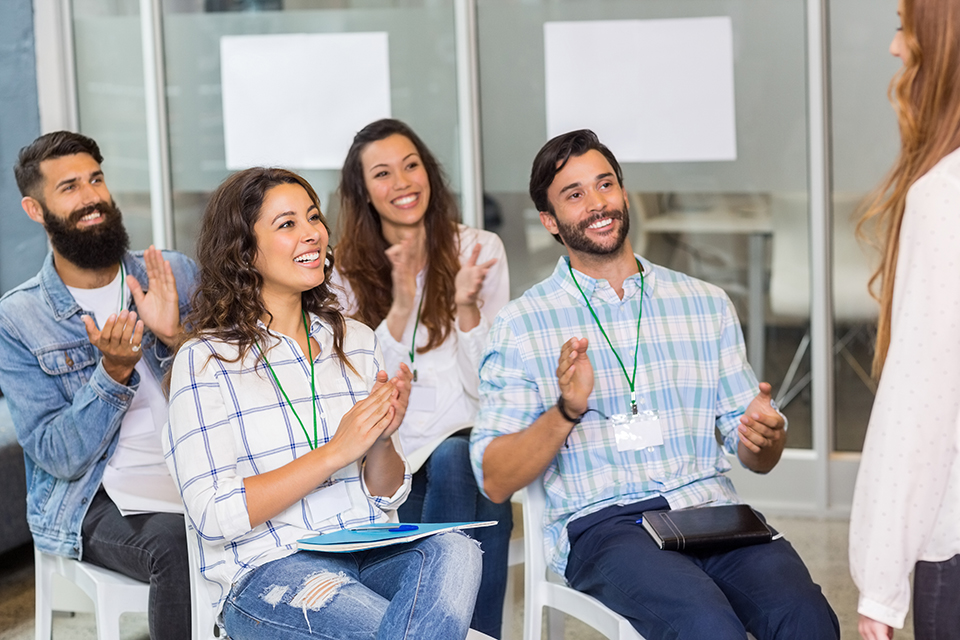 Attendees enjoying an in-person workshop.